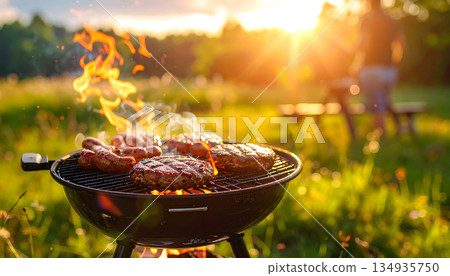 Enjoy the outdoors with meat and smoke from the barbecue grill Enjoy the outdoors with meat and smoke from the barbecue grill 134935750