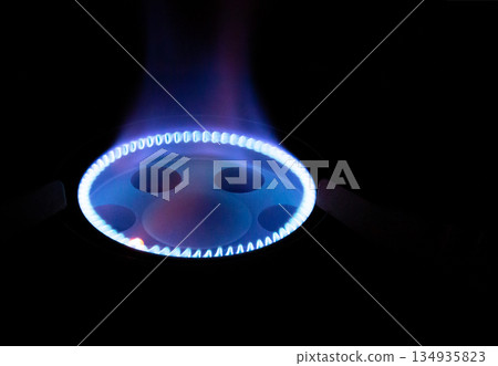 Blue flame of a gas stove Copy space 134935823