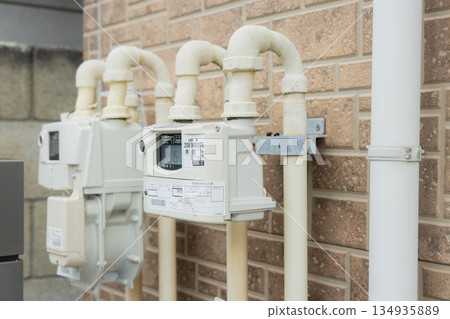 Gas meter installed on the exterior wall of a house Gas meter installed on the exterior wall of a house 134935889