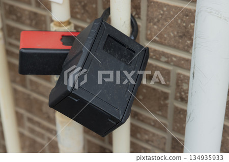 Key box attached to gas meter Key box attached to gas meter 134935933
