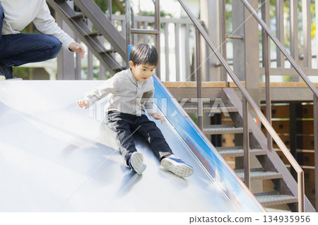 Family playing in the park 134935956