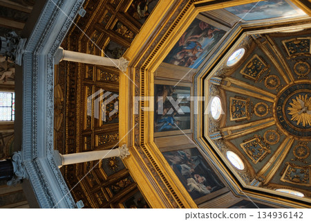 Archbasilica of Saint John Lateran interior Rome golden coffered ceiling marble columns statues ornate chapels baptistery and apse Catholic basilica Italy. High quality photo Archbasilica of Saint John Lateran interior Rome golden coffered ceiling marble columns statues ornate chapels baptistery and apse Catholic basilica Italy. High quality photo 134936142