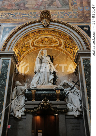 Archbasilica of Saint John Lateran interior Rome golden coffered ceiling marble columns statues ornate chapels baptistery and apse Catholic basilica Italy. High quality photo Archbasilica of Saint John Lateran interior Rome golden coffered ceiling marble columns statues ornate chapels baptistery and apse Catholic basilica Italy. High quality photo 134936147