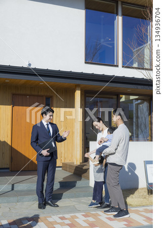 A salesman showing around a housing exhibition 134936704