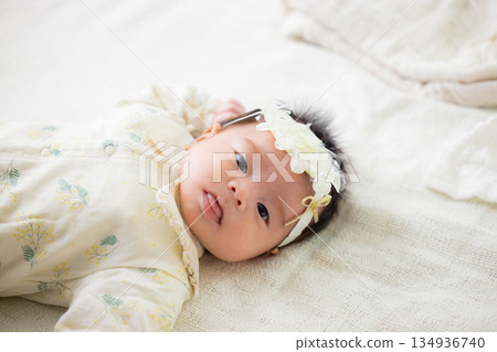 baby sleeping in bed 134936740