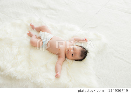 baby sleeping in bed 134936749