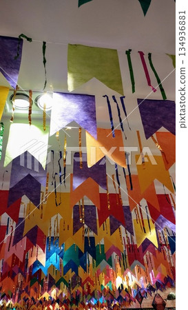 Light illuminating Junh Saint flags in purple, orange, green, red and blue. Light illuminating Junh Saint flags in purple, orange, green, red and blue. 134936881