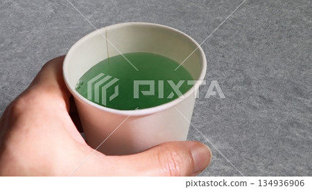 Person holding mouthwash 134936906