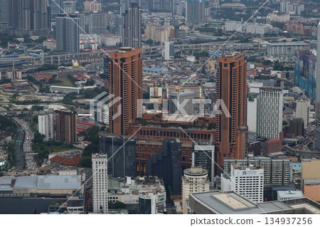 Wide cityscape of Kuala Lumpur, Malaysia, featuring mixed residential and commercial towers that reflect rapid urban growth. Wide cityscape of Kuala Lumpur, Malaysia, featuring mixed residential and commercial towers that reflect rapid urban growth. 134937256