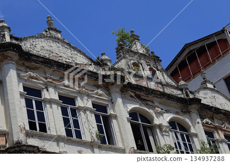Weathered colonial-era building facade in Kuala Lumpur, Malaysia, showing aged textures, ornate details, and historic urban architecture. Weathered colonial-era building facade in Kuala Lumpur, Malaysia, showing aged textures, ornate details, and historic urban architecture. 134937288