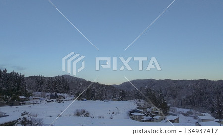 Aerial view of snowy moonrise Aerial view of snowy moonrise 134937417