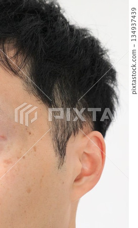 Close-up of a man with two-block hair Close-up of a man with two-block hair 134937439