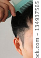Japanese man combing hair 134937565