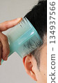 Japanese man combing hair 134937566