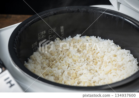 Freshly cooked sticky barley rice in a rice cooker 134937600