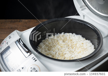Freshly cooked sticky barley rice in a rice cooker Freshly cooked sticky barley rice in a rice cooker 134937601