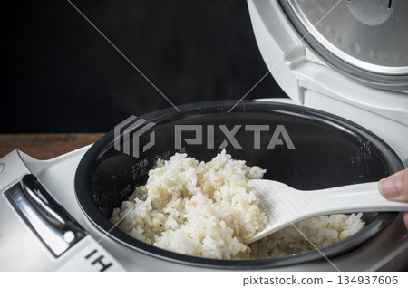 Freshly cooked sticky barley rice in a rice cooker Freshly cooked sticky barley rice in a rice cooker 134937606