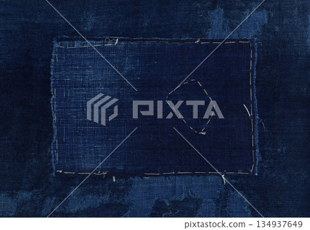 Faded indigo dyed fabric, patched old fabric Faded indigo dyed fabric, patched old fabric 134937649