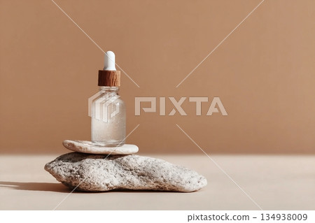 Glass dropper bottle with extract coconut or serum on stand from natural stones on beige background. Natural Organic Spa Cosmetic concept, cosmetic product mock up, minimal style. Side view, copyspace Glass dropper bottle with extract coconut or serum on stand from natural stones on beige background. Natural Organic Spa Cosmetic concept, cosmetic product mock up, minimal style. Side view, copyspace 134938009