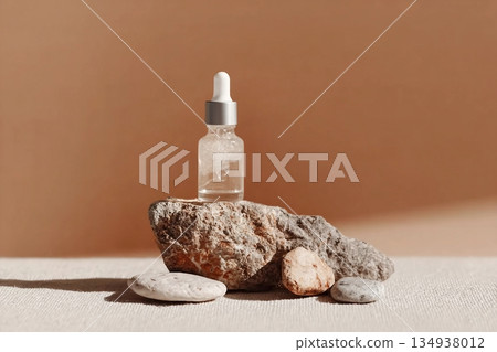 Glass dropper bottle with extract coconut or serum on stand from natural stones on beige background. Natural Organic Spa Cosmetic concept, cosmetic product mock up, minimal style. Side view, copyspace Glass dropper bottle with extract coconut or serum on stand from natural stones on beige background. Natural Organic Spa Cosmetic concept, cosmetic product mock up, minimal style. Side view, copyspace 134938012
