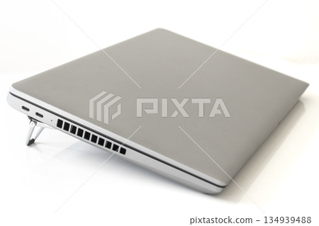 Image of a laptop tilted on a PC stand Image of a laptop tilted on a PC stand 134939488