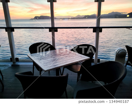Interior of the abstract modern cruise ship and sea at sunset Interior of the abstract modern cruise ship and sea at sunset 134940187