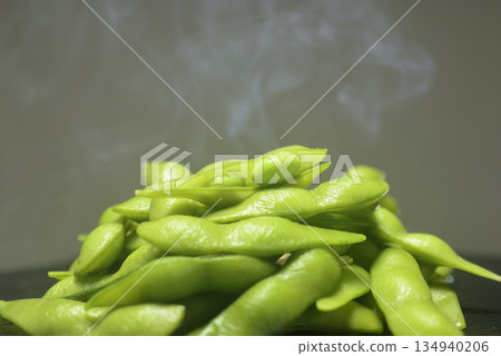 Steam rising from freshly boiled edamame beans Steam rising from freshly boiled edamame beans 134940206