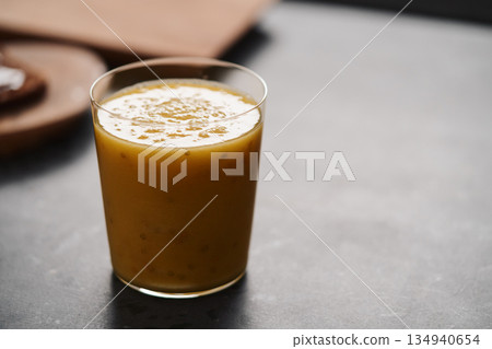Fresh mango lulo smoothie on kitchen countertop Fresh mango lulo smoothie on kitchen countertop 134940654
