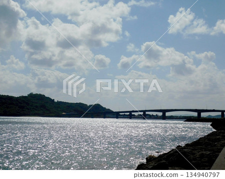 View of Hamahiga Island Mid-Sea Road from the coast of Henza Island View of Hamahiga Island Mid-Sea Road from the coast of Henza Island 134940797