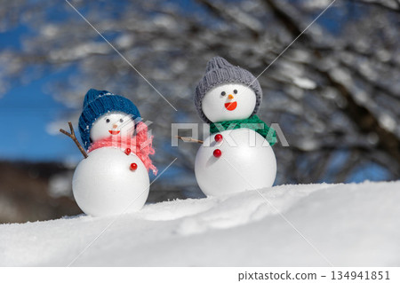 Fresh snow and a pair of snowmen 134941851