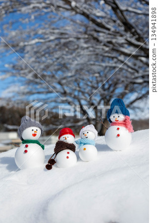 Fresh snow and snowman family Fresh snow and snowman family 134941898