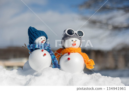 Fresh snow and a pair of snowmen 134941961