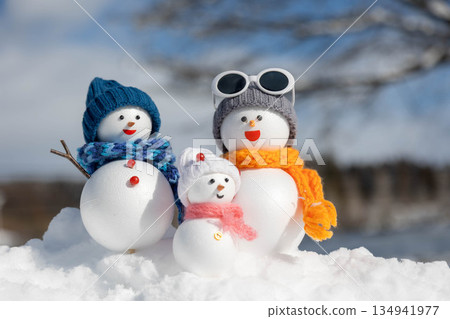 Fresh snow and snowman family Fresh snow and snowman family 134941977