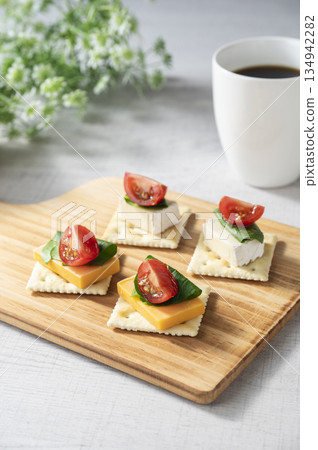 Cheese topping on crackers 134942282