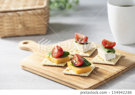 Cheese topping on crackers Cheese topping on crackers 134942286