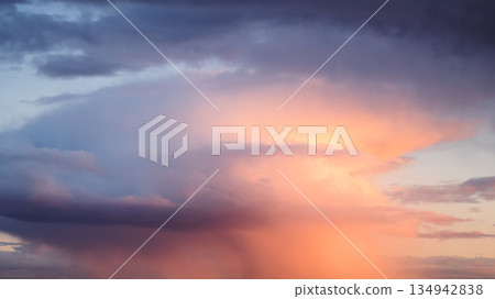 Rain streaks from clouds during sunset time 134942838