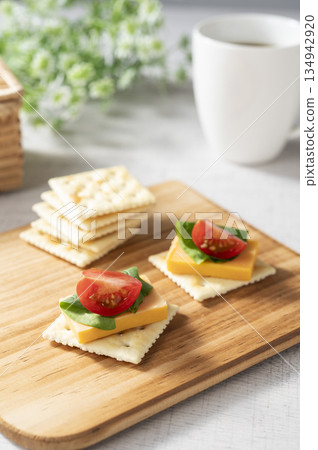 Cheese topping on crackers Cheese topping on crackers 134942920