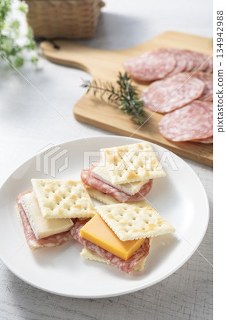 Cheese and salami sausage sandwich on crackers 134942988