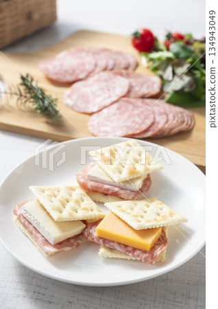 Cheese and salami sausage sandwich on crackers Cheese and salami sausage sandwich on crackers 134943049