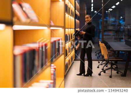 Student researching in a modern library 134943240