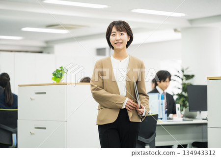 Portrait of a young career woman working in an office 134943312