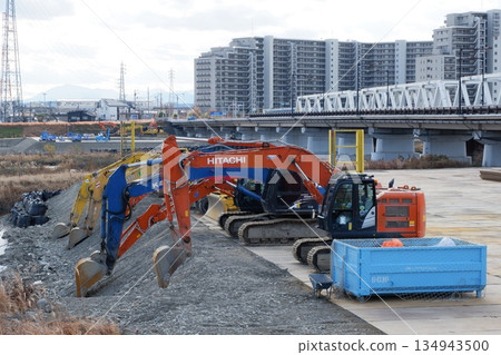 Heavy machinery at the river improvement site Heavy machinery at the river improvement site 134943500
