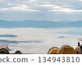 Camping tents in the mountains, and morning mist. 134943810