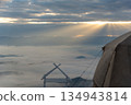 Camping tents in the mountains, and morning mist. 134943814