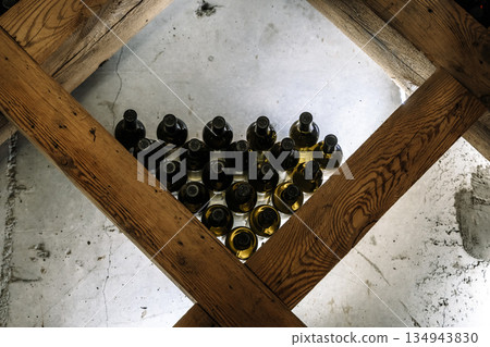 Modern Wine Cellar Display with Wooden Grid and Backlighting Modern Wine Cellar Display with Wooden Grid and Backlighting 134943830