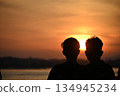Two people pledging their friendship to the rising sun Two people pledging their friendship to the rising sun 134945234