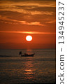 Fishing boats leaving port at sunrise Fishing boats leaving port at sunrise 134945237