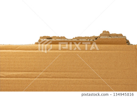 Several pieces of brown corrugated cardboard stacked together, showing various torn edges and layers. Great for a grunge or industrial design element. On a transparent background. Several pieces of brown corrugated cardboard stacked together, showing various torn edges and layers. Great for a grunge or industrial design element. On a transparent background. 134945816