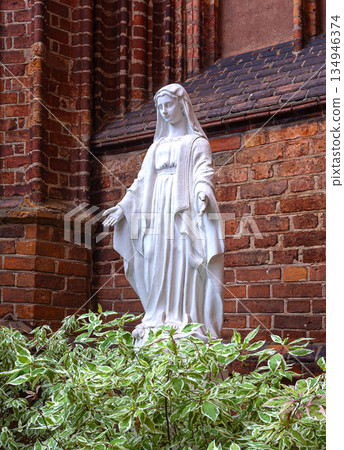 Virgin mary statue offering comfort and spirituality Virgin mary statue offering comfort and spirituality 134946374