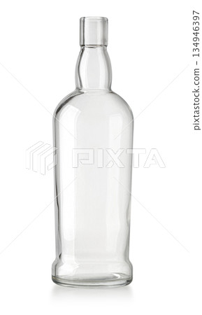Clear glass empty liquor bottle on white background Clear glass empty liquor bottle on white background 134946397